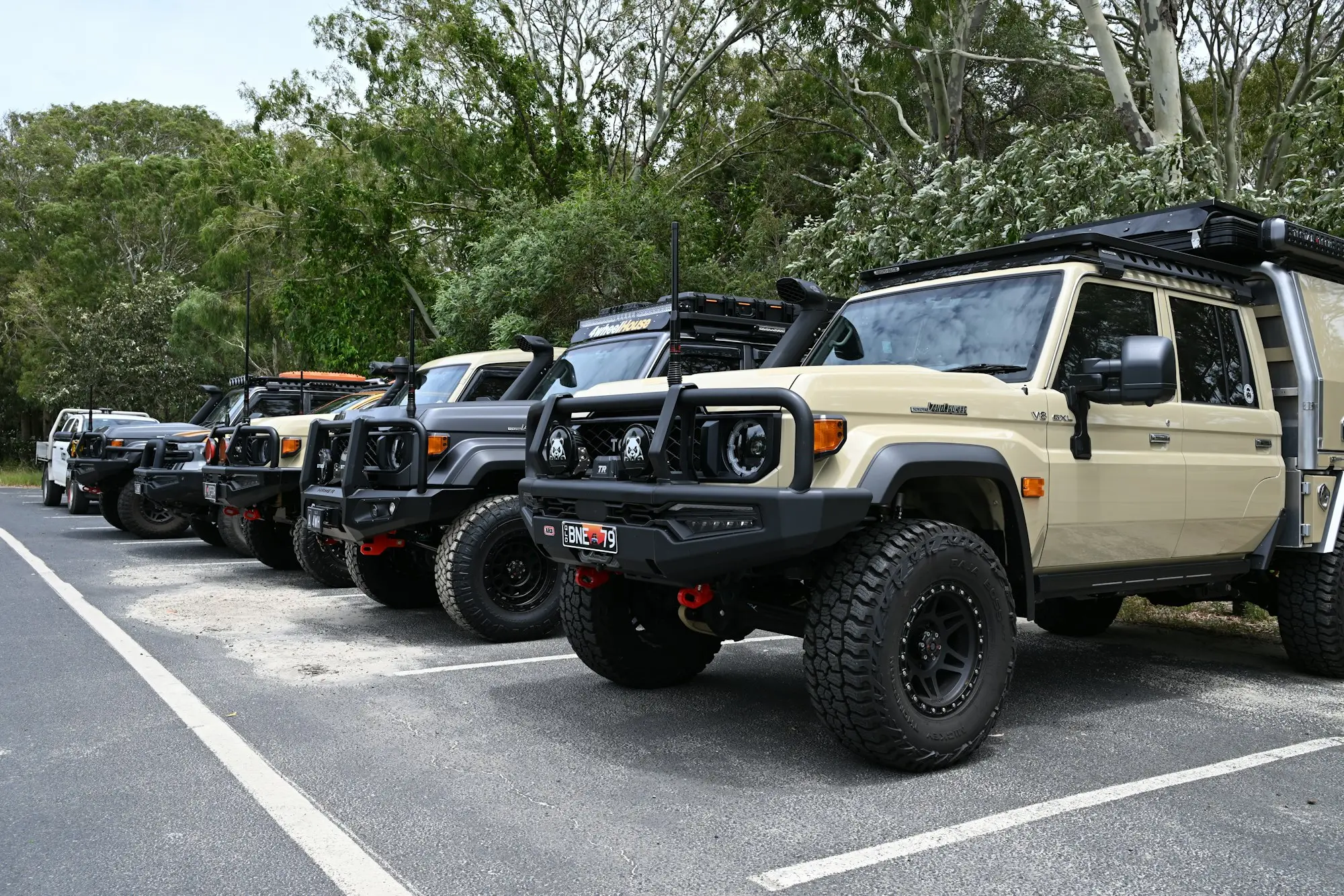 Rows of new utes on a dealership yard