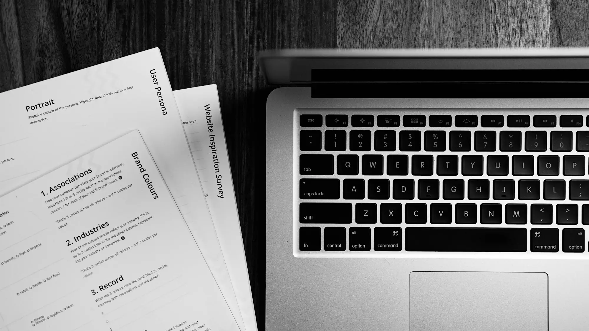 Electric car lease paperwork laid beside a laptop on a dark timber desk, ready for an FBT timing review before April 2027